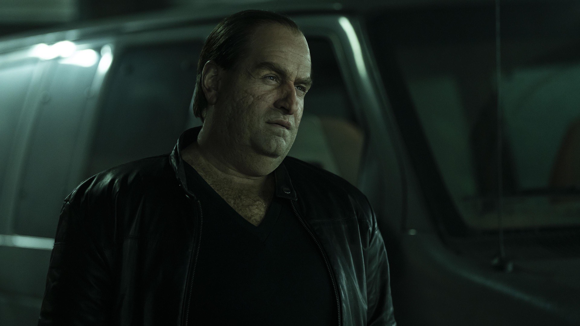 The Penguin — Oz Cobb standing beside a van at night, lit by a hard practical inside the vehicle