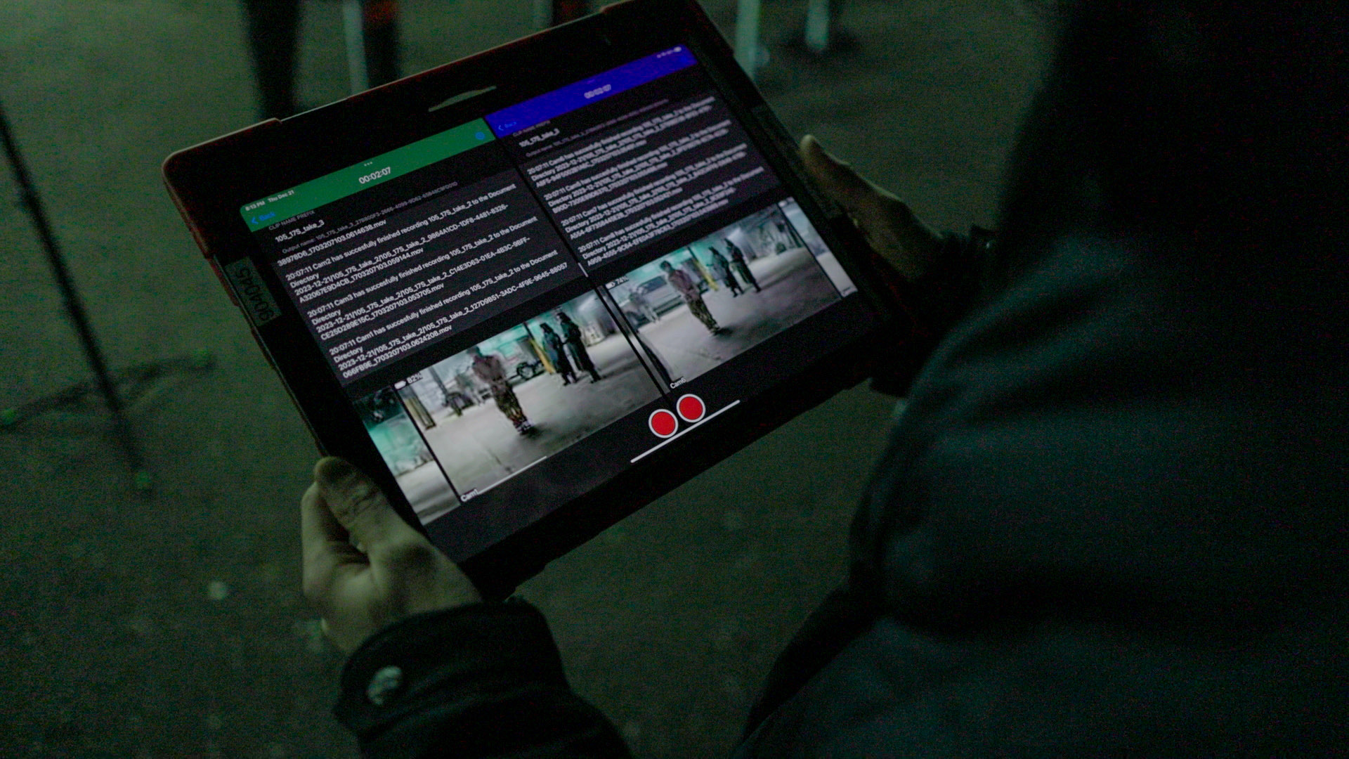 The Apollo control screen held on an iPad, showing two live camera feeds side by side with record indicators