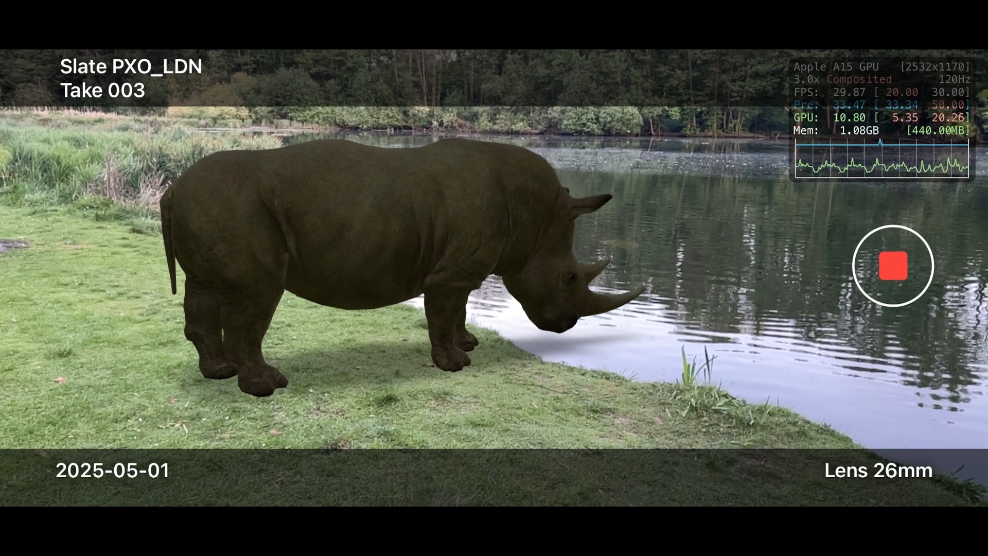 The app's recording view: a CG rhinoceros by a lake, with slate PXO_LDN take 003, the date, a 26mm lens label and a live performance graph