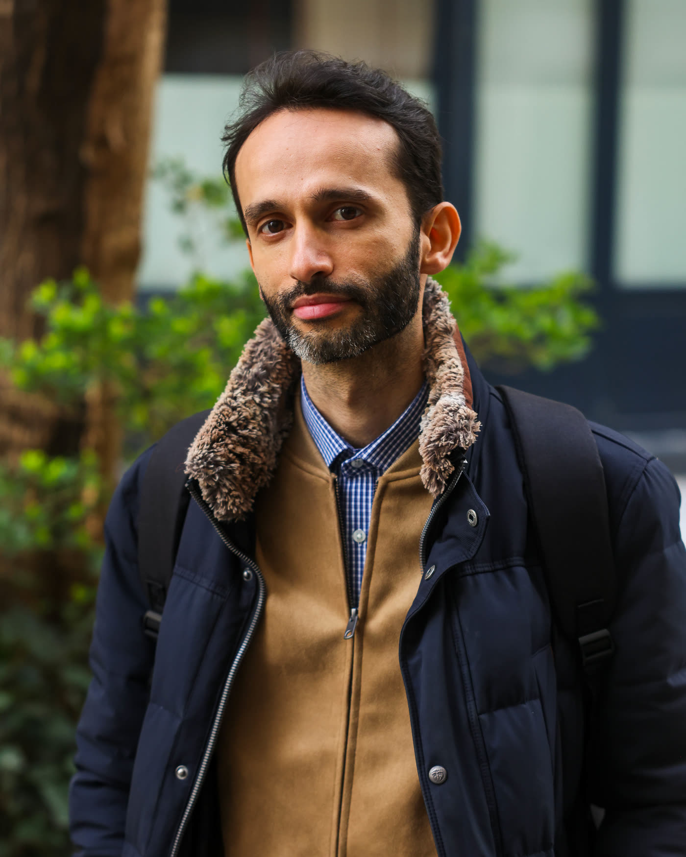 Portrait of Emal Saifi, outdoors, in a dark jacket